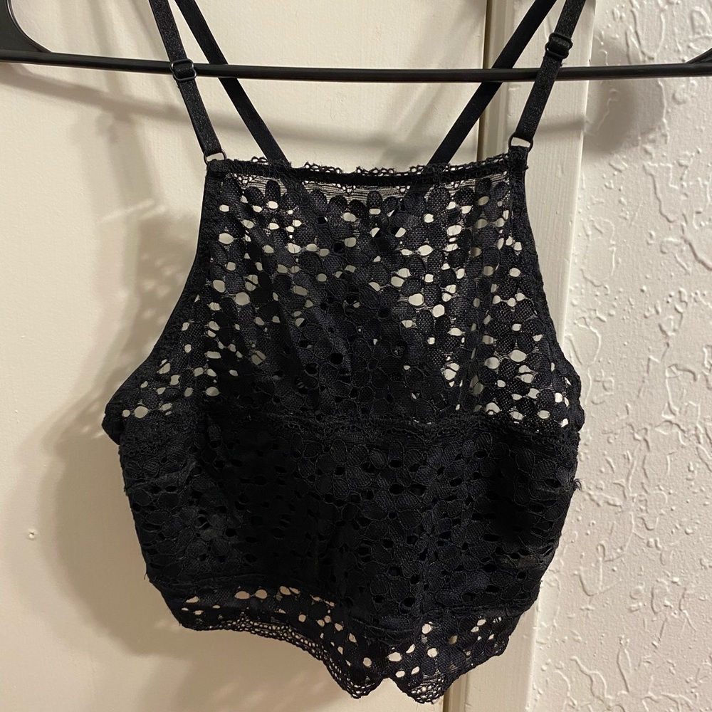 Black crop top . Size small . Covers the cleavage